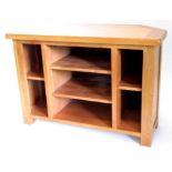 A solid oak television stand, with adjustable shelves, 98cm wide.