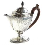 A George III silver neoclassical shaped small teapot, of oval form with an acorn finial, wooden