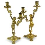 A pair of continental gilt brass two branch figural candelabra, 32cm high.