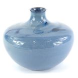 An Ashby Guild pottery vase, decorated with a blue flambe type glaze, 13cm high, impressed mark to