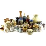 A large collection of Studio pottery, to include an alarm clock, a Mary Pancost carafe with three