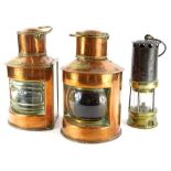 A pair of ship's copper and brass port and starboard lanterns, 26cm high and a brass and steel