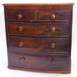 A Victorian mahogany bow fronted chest of drawers, the top with a moulded edge, above two short