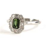 A modern green tourmaline and diamond dress ring, the ring head with rectangular cut green