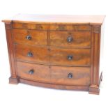 A Victorian mahogany bow fronted chest of drawers, with two short and two long drawers, each with