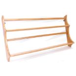 An Ercol elm two tier plate rack, 96cm wide.