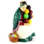 A Royal Doulton porcelain figurine, The Old Balloon Seller, HN1315, 19cm high.