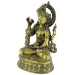 An eastern Avalokiteshvara gilt brass figure, on a shaped base, 20cm high.