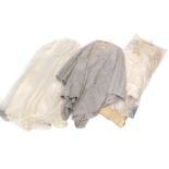 Various items of vintage clothing, to include a cream 1950s wedding dress, wool jacket, veil,