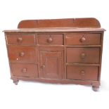 A Victorian painted pine dresser, the top with a raised back and a moulded edge, above an