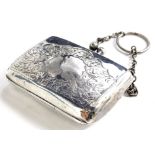 A George V silver purse, engraved with scrolls and with a plain chain, Birmingham 1913, 5.5cm wide.