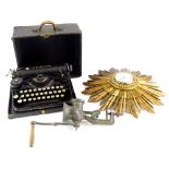 A Sunburst wall clock, stamped Bravingtons Limited London to the paper dial, a mincer and an