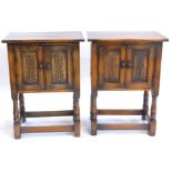 A pair of oak Bevan Funnell side cabinets, each with two carved panelled doors on turned supports,