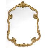 A gilt gesso cartouche carved mirror, with foliate crest, etc. 76cm high, 46 wide.