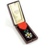 A Legion D'Honneur, in white and green enamel, with ribbon and original case.