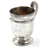 A late Victorian silver christening mug, with shaped handle and moulded borders, engraved F.E.S.B.