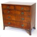An early 19thC mahogany chest of drawers, the top with a moulded edge above two short and three long