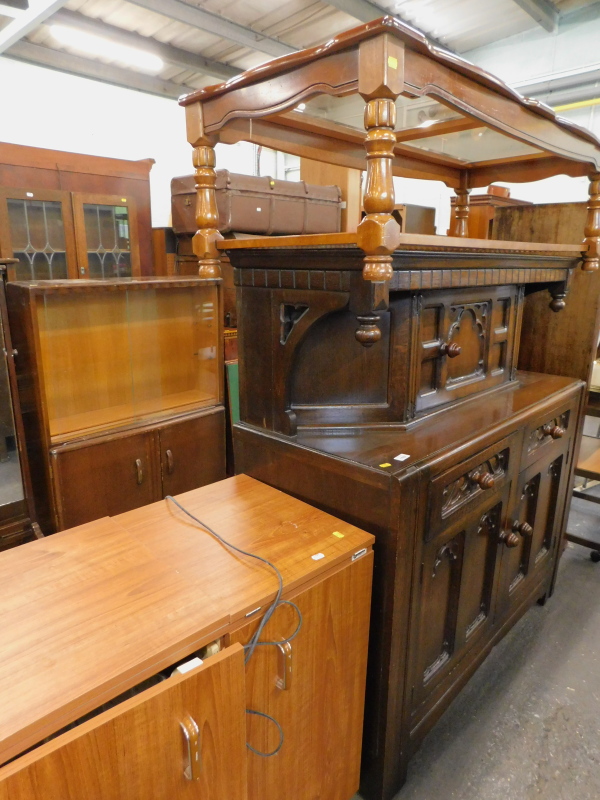 An oak court cupboard, two tier glazed top coffee table, and an electric sewing machine in