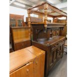 An oak court cupboard, two tier glazed top coffee table, and an electric sewing machine in