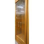 An oak two door glazed front display cabinet/bookcase.
