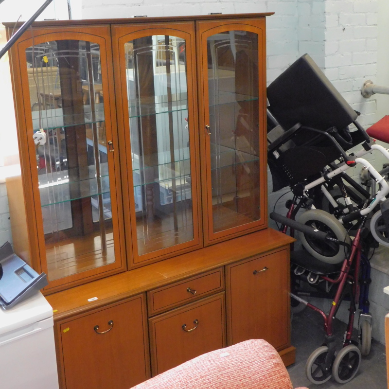 A Sakol Furniture display cabinet, and a quantity of mobility aids.