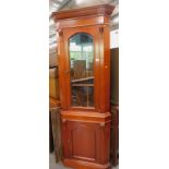 A freestanding corner cabinet and a mahogany music centre cabinet (2).
