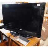 A Technika 32" television, with lead, remote and operating instructions.