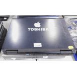 Three Toshiba laptops, lacking internal components and power leads.