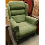An armchair, in green fabric. The upholstery in this lot does not comply with the 1988 (Fire &