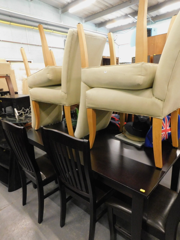 A hardwood dining table, with six associated chairs, a further four cream upholstered dining chairs,