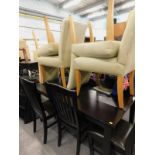 A hardwood dining table, with six associated chairs, a further four cream upholstered dining chairs,