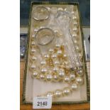 A pair of salts with silver collars, faux pearl necklaces, etc. (1 box).