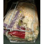 A patchwork quilt, woven rug, etc., (1 bag).