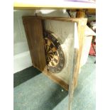 A dartboard, in fitted oak surround.