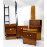 A collection of Ladderax type 1960's/70's teak sectional furniture, to include cupboards, drawer