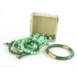 Various jade and other necklaces, comprising a graduated pale jade necklace, with spherical beads, a