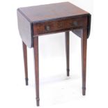 A 19thC mahogany and ebony strung work table, the rectangular top with two drop flaps, on square