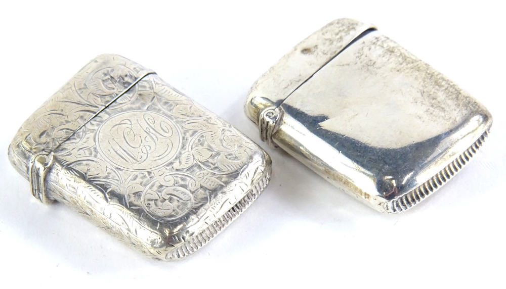 Two silver Vesta cases, one with engraved decoration, the other of plain form, Birmingham 1916 and