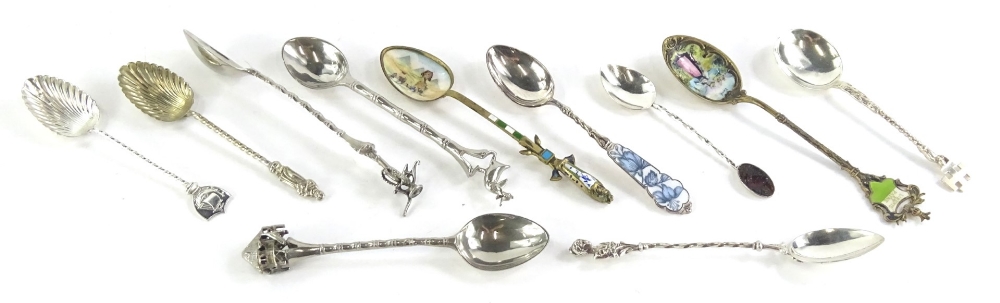 A collection of silver, white metal and silver plated souvenir spoons, to include the Philippines,