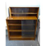 Two teak bookcases, each with sliding doors.