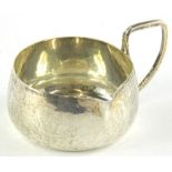 An Edwardian Arts & Crafts silver side handled milk jug, of plain form, with angular handle, Chester