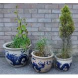 A Chinese stoneware jardiniere decorated in blue with a dragon, and two similar jardinieres.