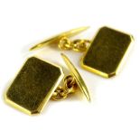 A pair of cufflinks, each with rectangular cut front, and diamond set back, yellow metal with