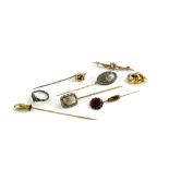 Various stick pins, comprising a stick pin with hand and cultured pearl, a Victorian memorial