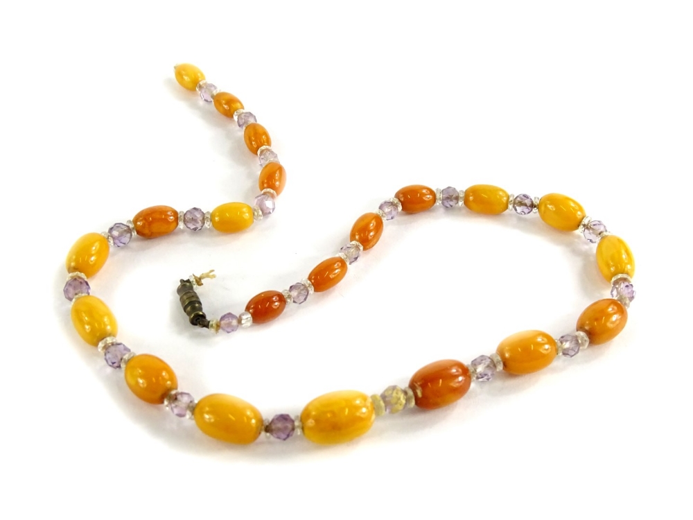 A butterscotch amber beaded necklace, with graduated design butterscotch beads and other clear set