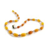 A butterscotch amber beaded necklace, with graduated design butterscotch beads and other clear set