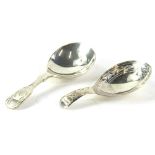 An Elizabeth II silver caddy spoon, each leaf engraved handle, Sheffield 1971 and a 19thC silver