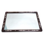 A rectangular mother of pearl finish polished hardwood mirror, set with a repeat decoration of