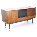 A 1960s G-Plan walnut and ebonised sideboard, designed by E. Gomme, on turned legs, 144cm wide.