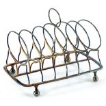 A George III silver six division toast rack, with loop handle, ball feet, London 1809, 7¾oz, 17cm